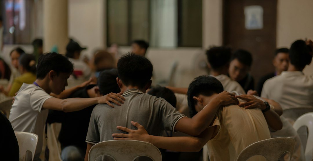 Group praying together in Christian fellowship