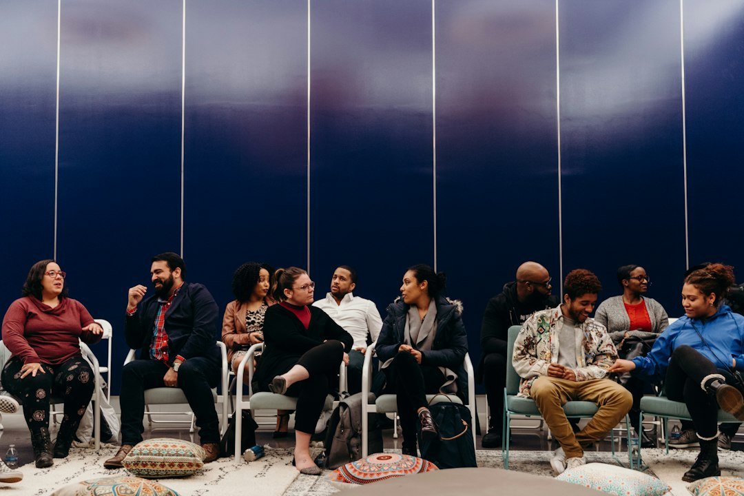 Diverse community group sharing conversation and encouragement